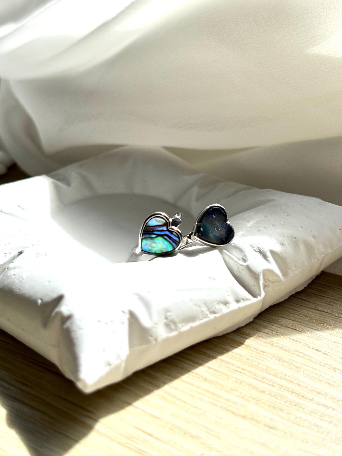 Heart-Shaped Mother of Pearl Huggie Earrings with Black and Blue Hues – Sterling Silver Wire