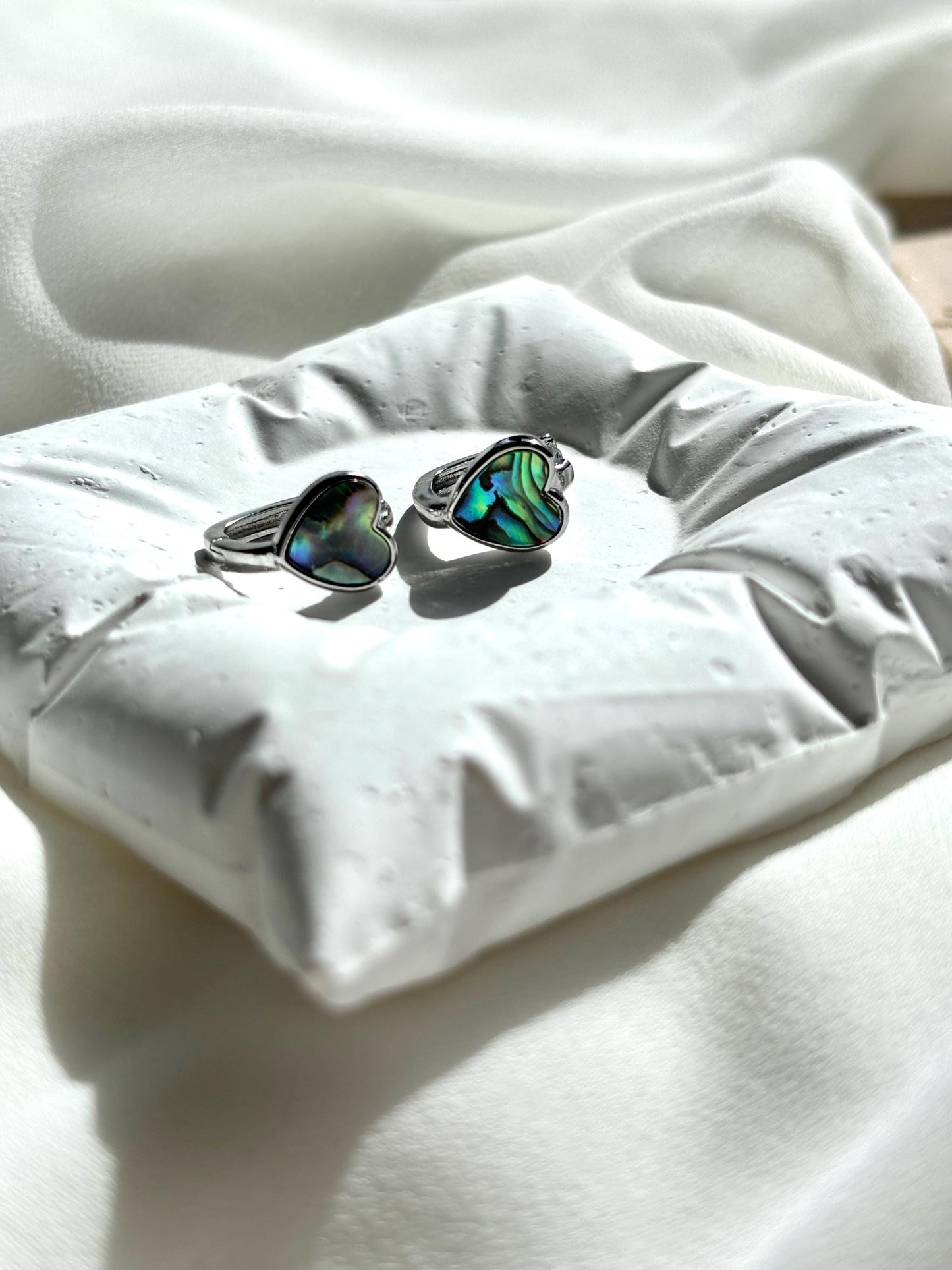 Heart-Shaped Mother of Pearl Huggie Earrings with Black and Blue Hues – Sterling Silver Wire