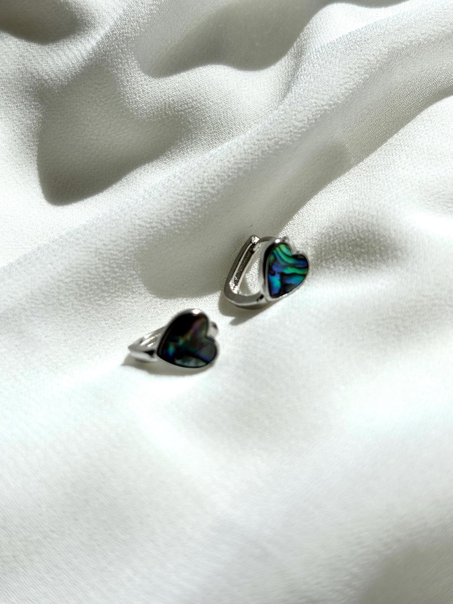 Heart-Shaped Mother of Pearl Huggie Earrings with Black and Blue Hues – Sterling Silver Wire