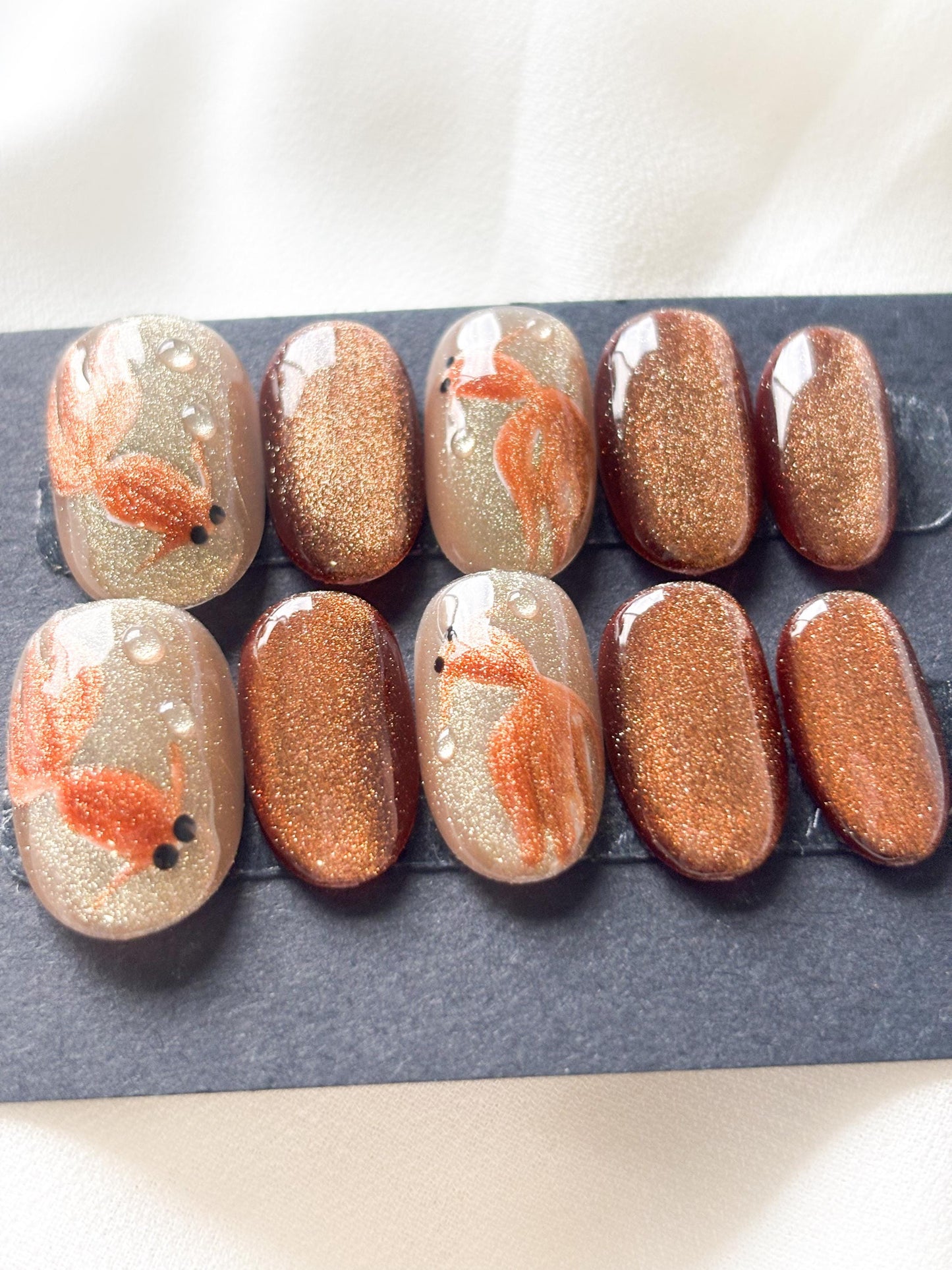 Golden Pond – Glitter Gold & Brown Press-On Nails with Gold Fish Accents | Reusable Nail Set