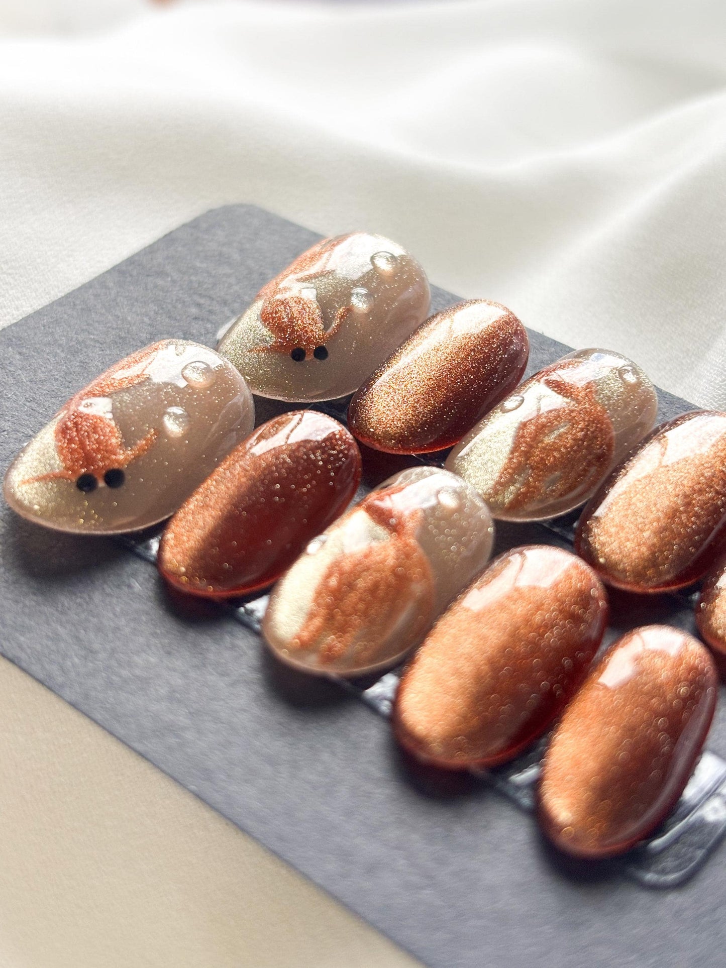 Golden Pond – Glitter Gold & Brown Press-On Nails with Gold Fish Accents | Reusable Nail Set