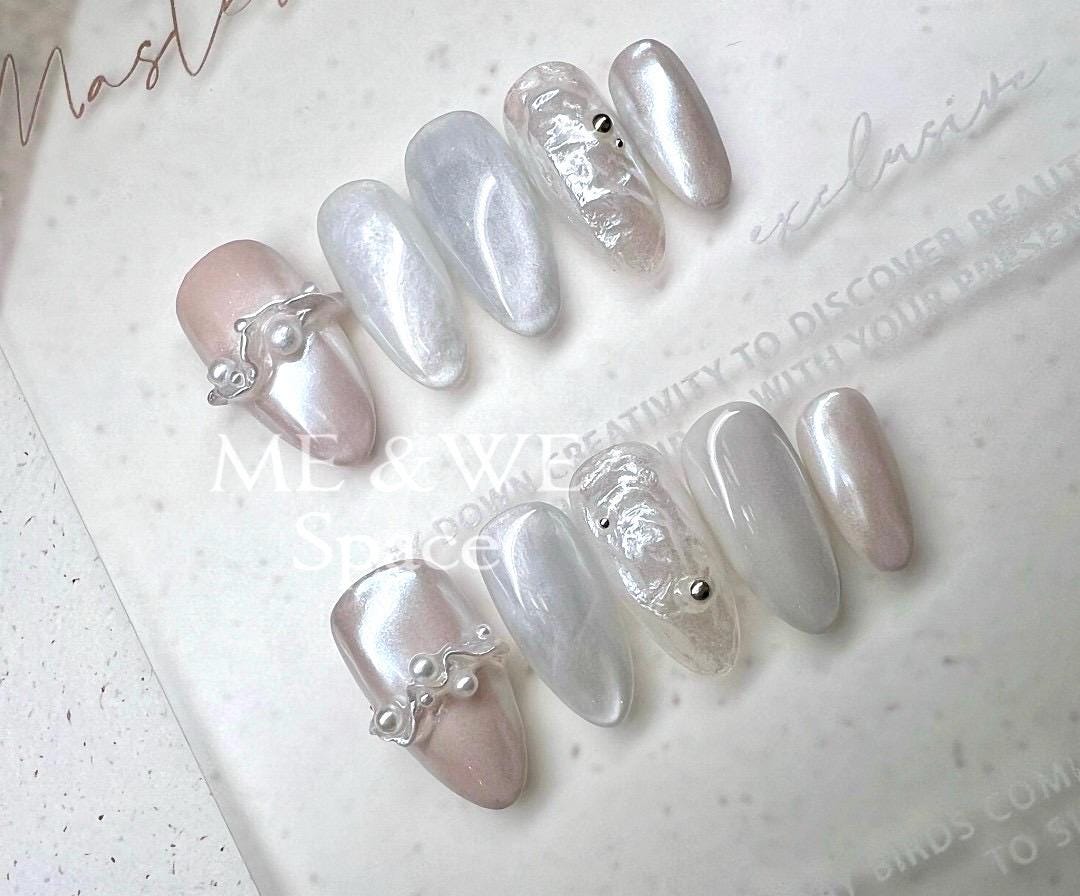 Pearls in splashing water press-on nail (Middle Almond)  Only XS available