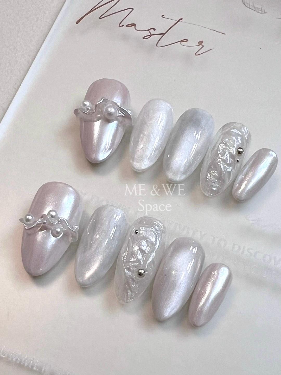Pearls in splashing water press-on nail (Middle Almond)  Only XS available
