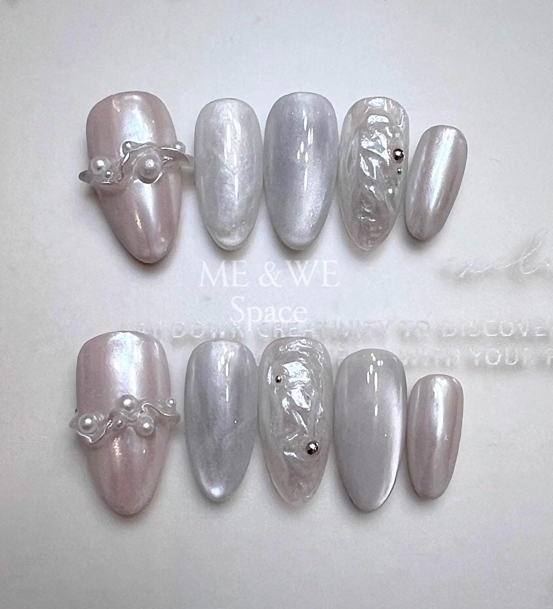 Pearls in splashing water press-on nail (Middle Almond)  Only XS available
