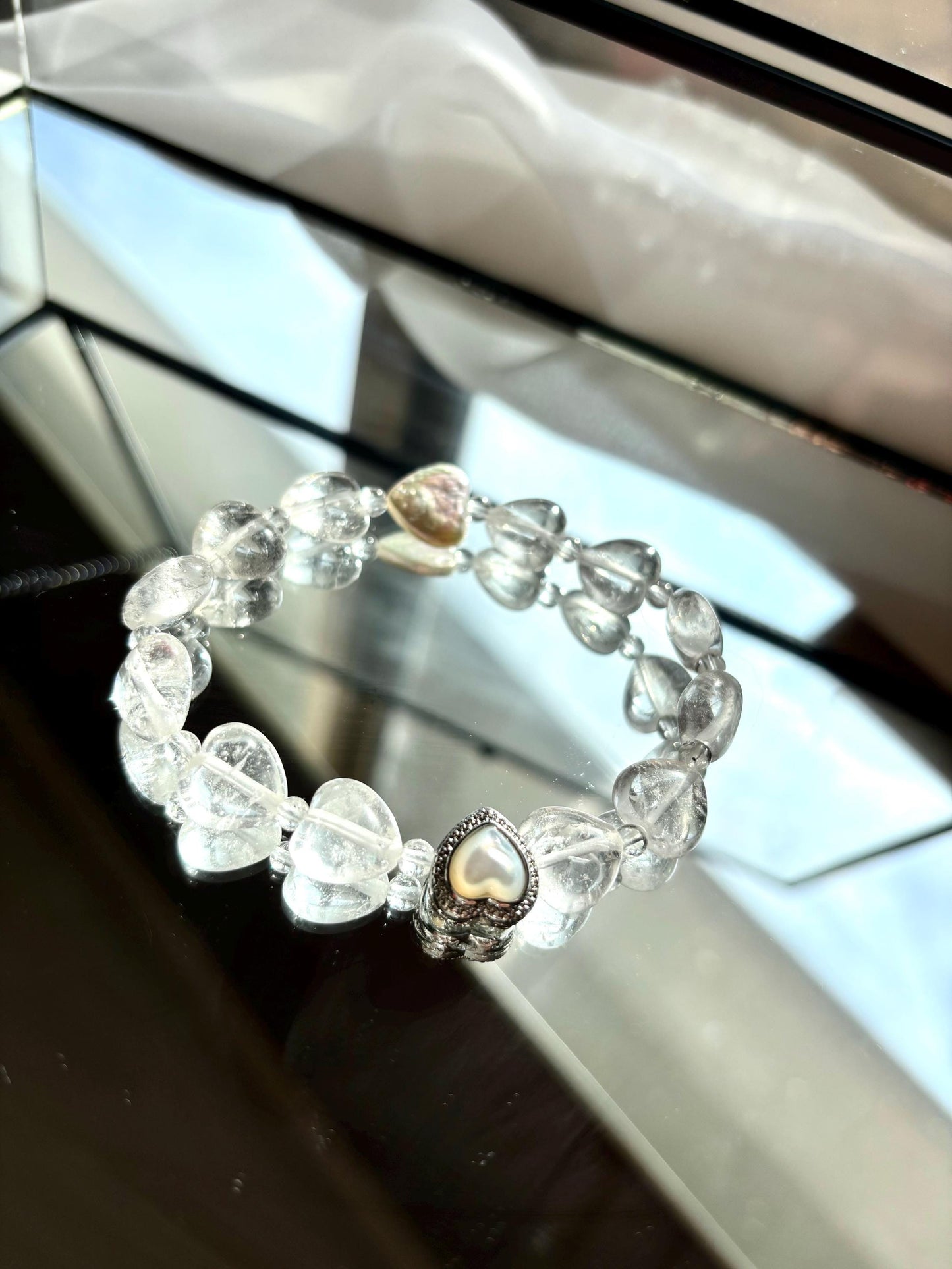 Icy Heart Clear Quartz Bracelet with Heart-Shaped Beads, Pearl, and Mother of Pearl Accents.