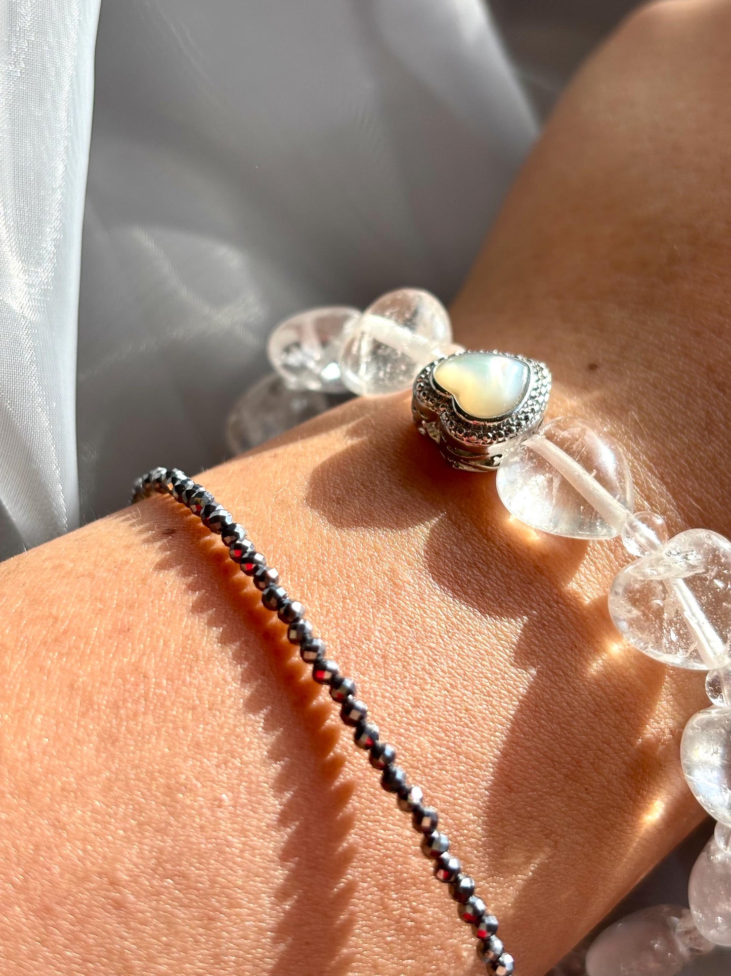 Icy Heart Clear Quartz Bracelet with Heart-Shaped Beads, Pearl, and Mother of Pearl Accents.