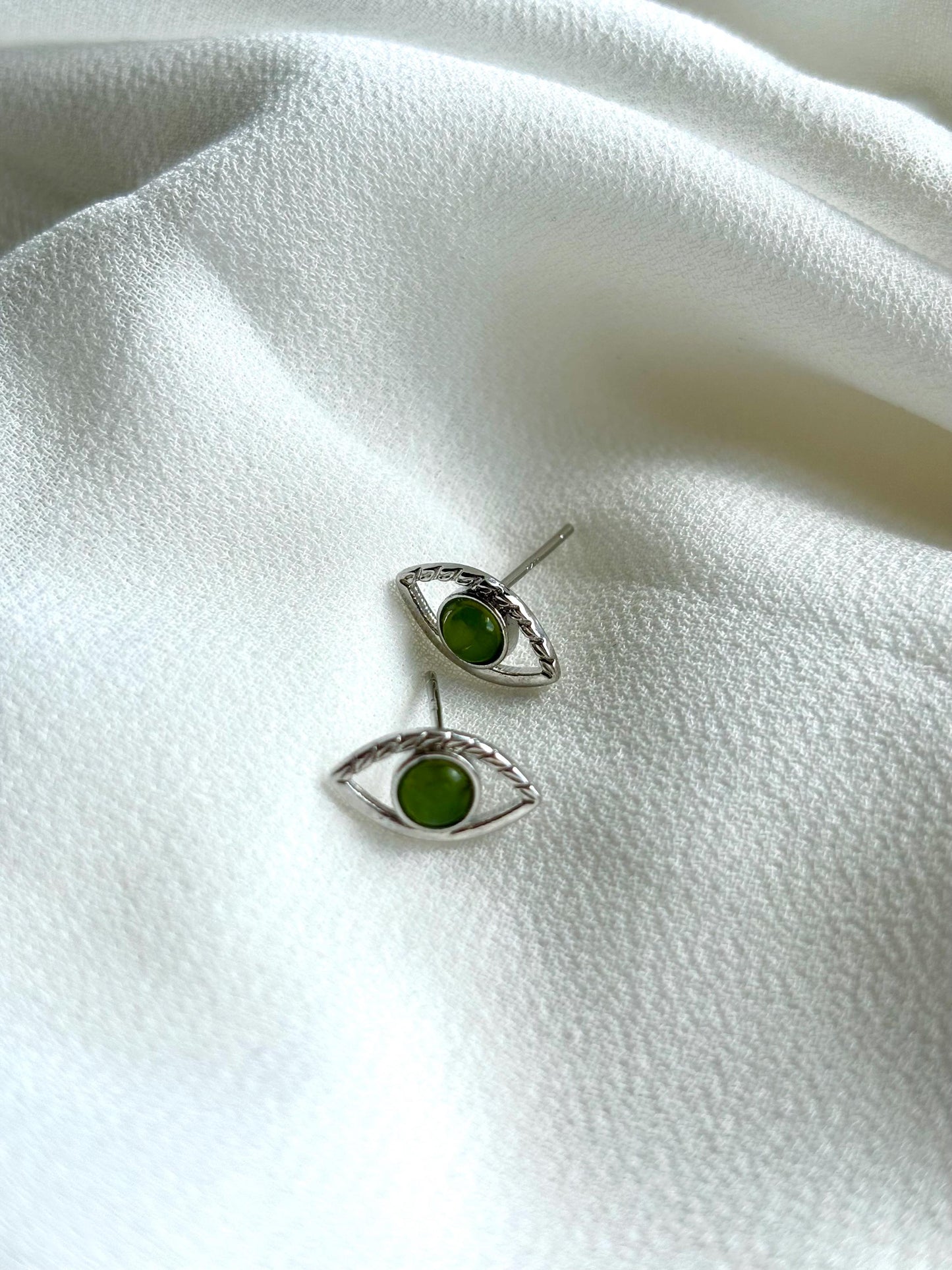 Serpent’s Gaze: Serpentine Eye Stud Earrings