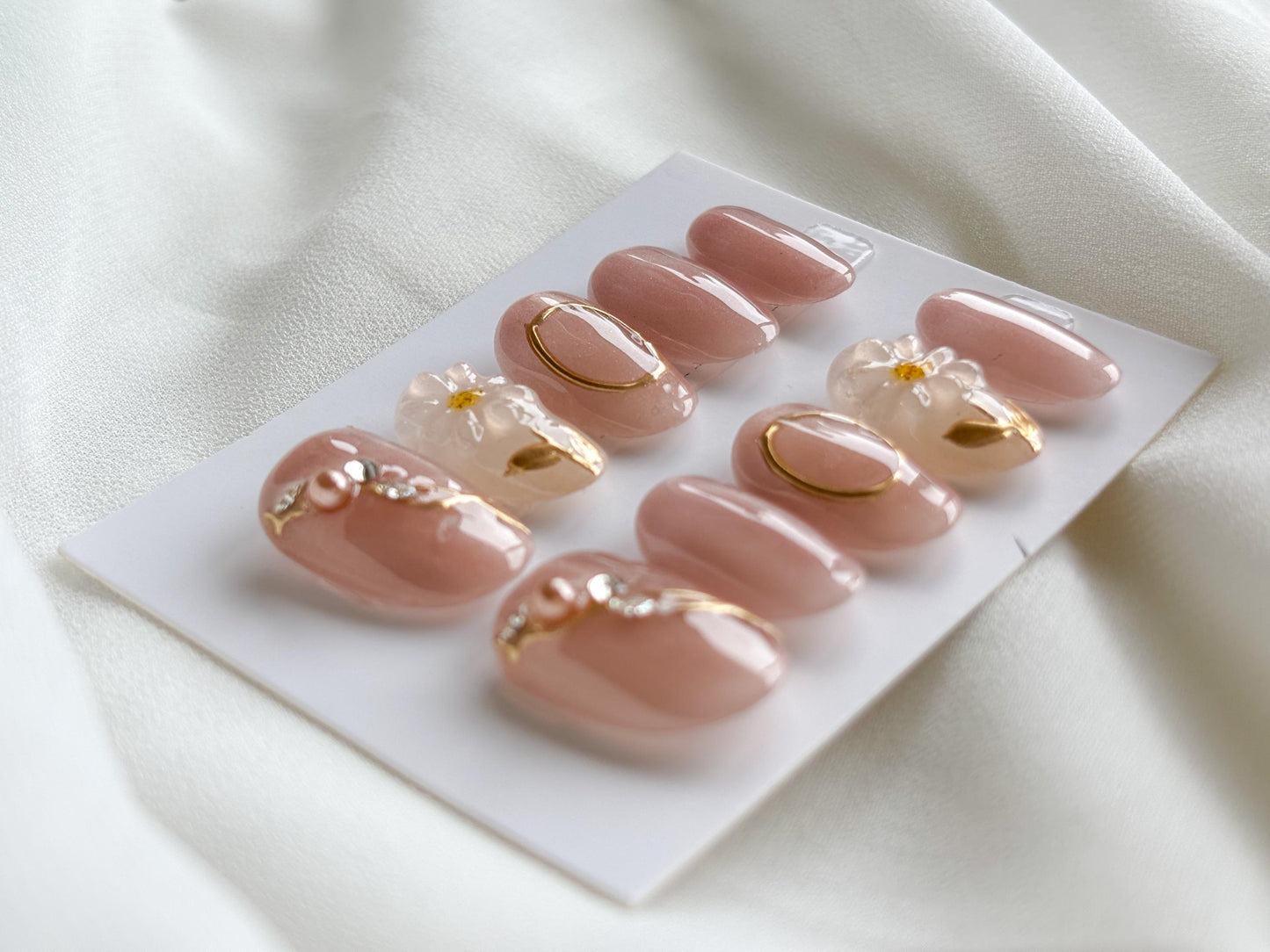 Blush Glow Press-On Nails – Pink Base with Gold Accents & White Floral Accent Nail