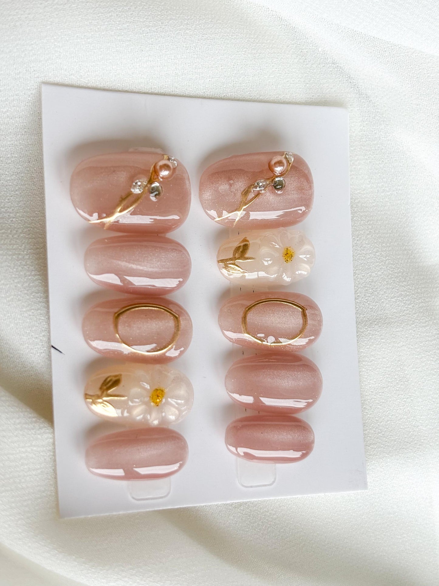 Blush Glow Press-On Nails – Pink Base with Gold Accents & White Floral Accent Nail