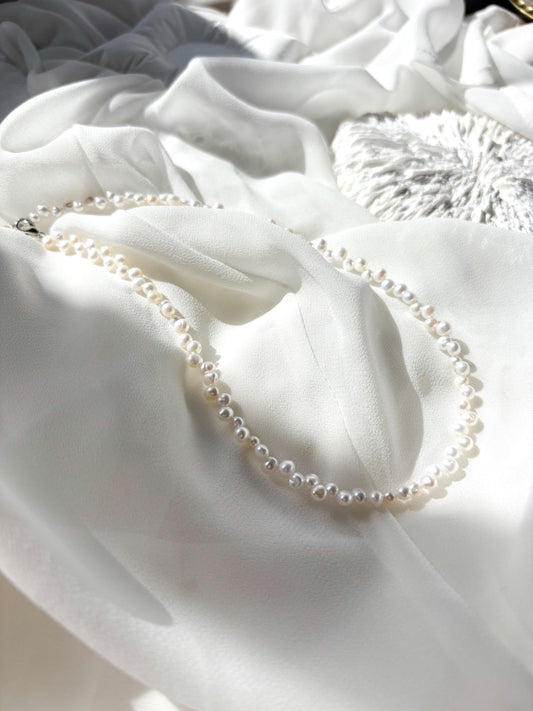 Snow Petal – Staggered White Freshwater Pearl Necklace